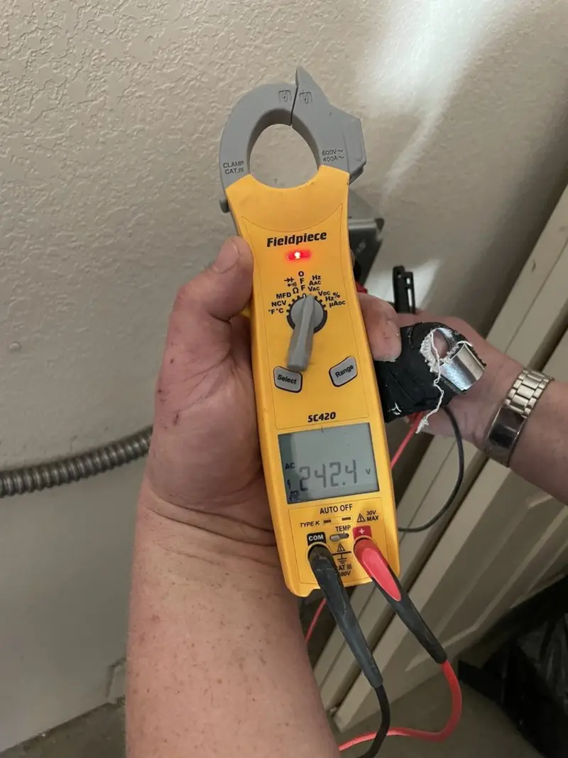 Voltage testing with clamp meter during Outlet Installation in Hiram